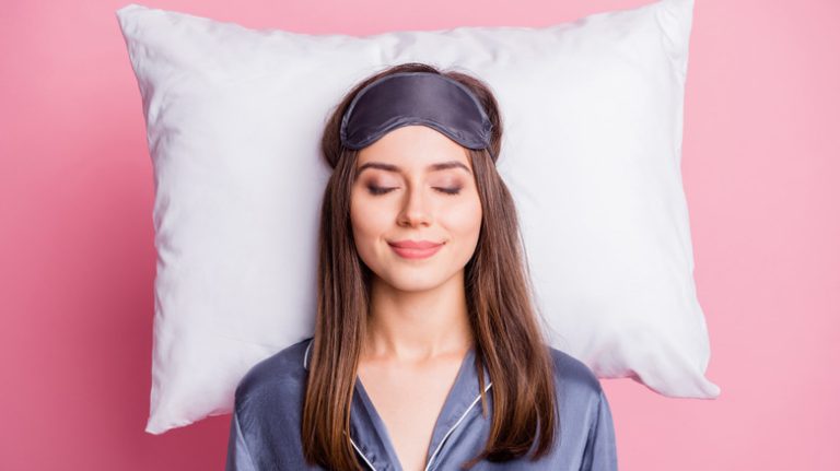 woman lying on pillow