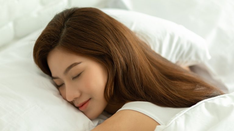 woman sleeping in bed