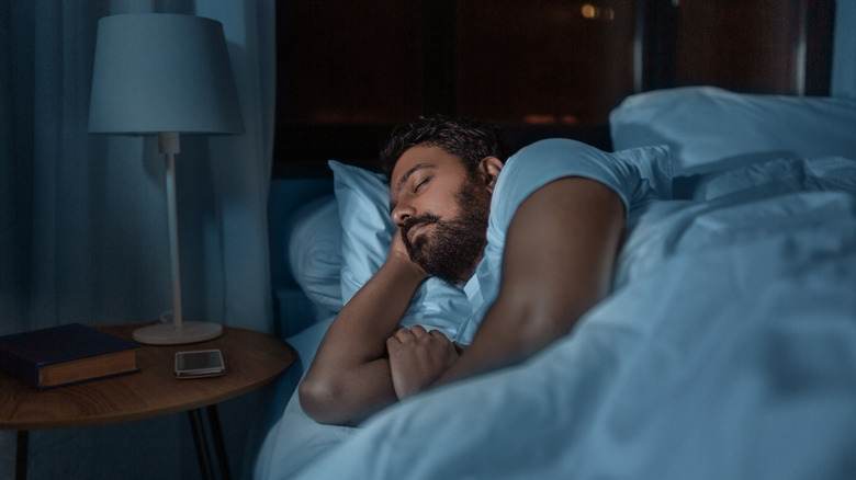 Man sleeping soundly in bed