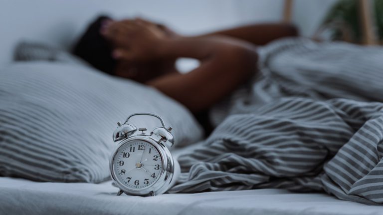 woman touching clock