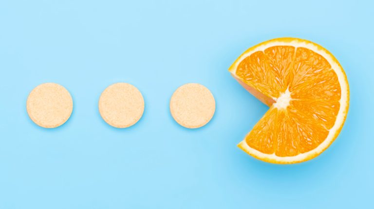 Vitamin C supplements with C-shaped orange