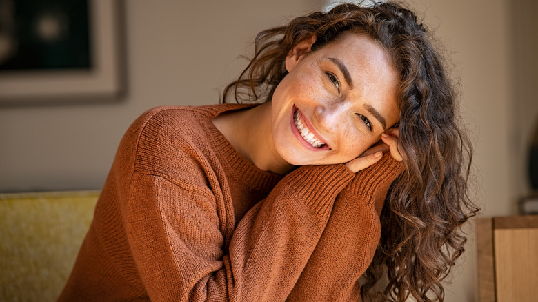 Woman smiling broadly into camera