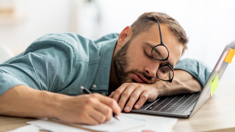 A man asleep at work