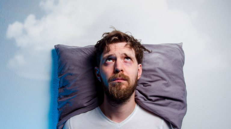 Man on pillow looking up at sky