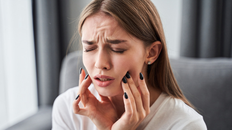 woman having tooth pain