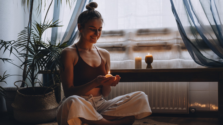 woman finding calm while sitting in meditation