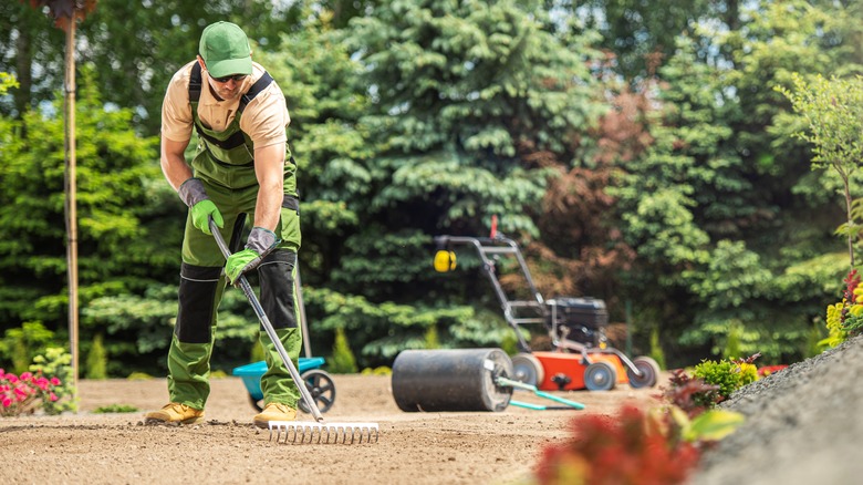 man preparing a landscaping area