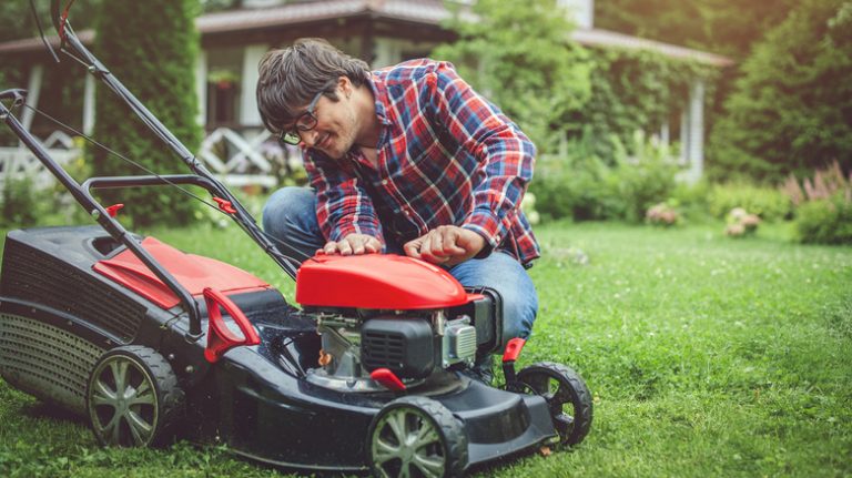 Confused homeowner tending to mower