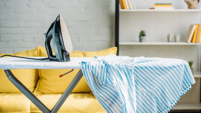 ironing board with iron and shirt