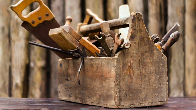 Wooden toolbox with tools inside