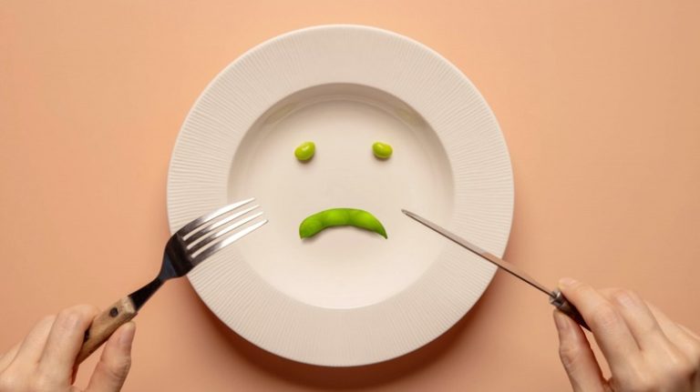 Sad face of peas on plate