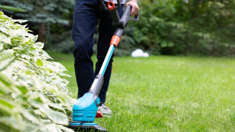 Man using lawn edger