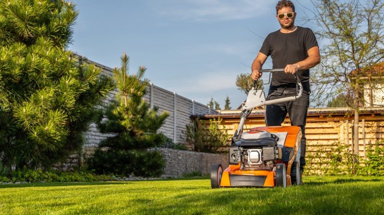 Person mowing lawn