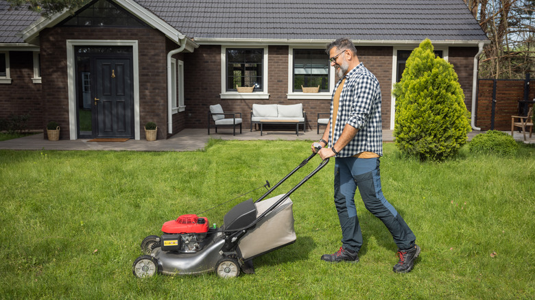 man mowing lawn