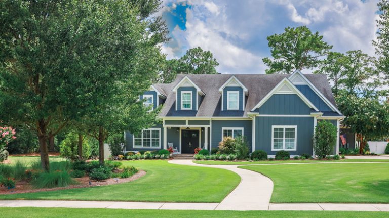 house with shade trees