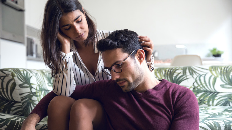 woman consoling man with depression