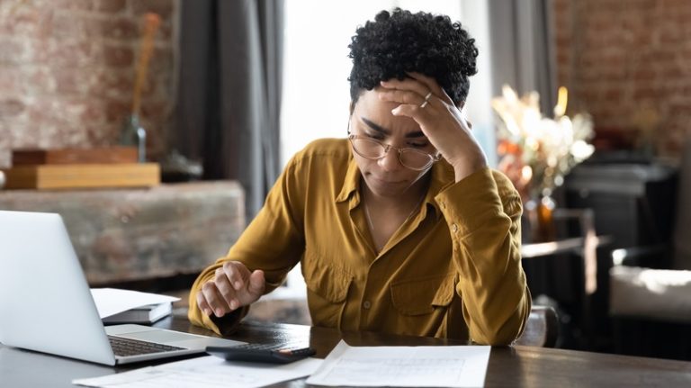 Stressed person working at desk