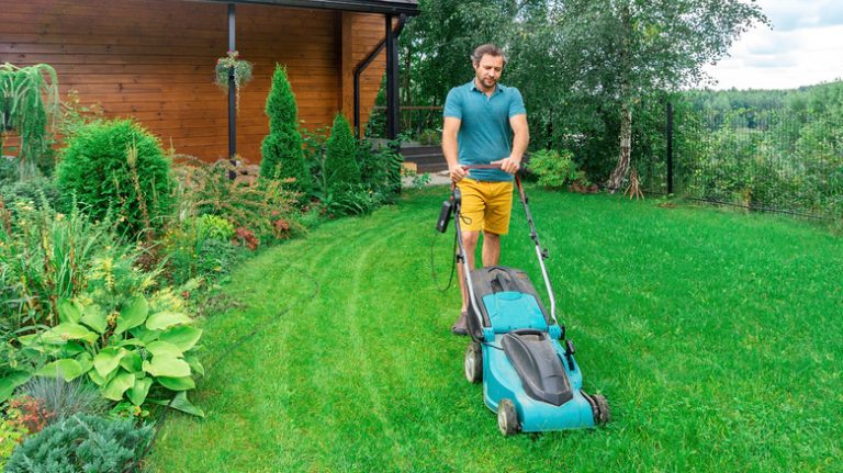 man mowing his lawn