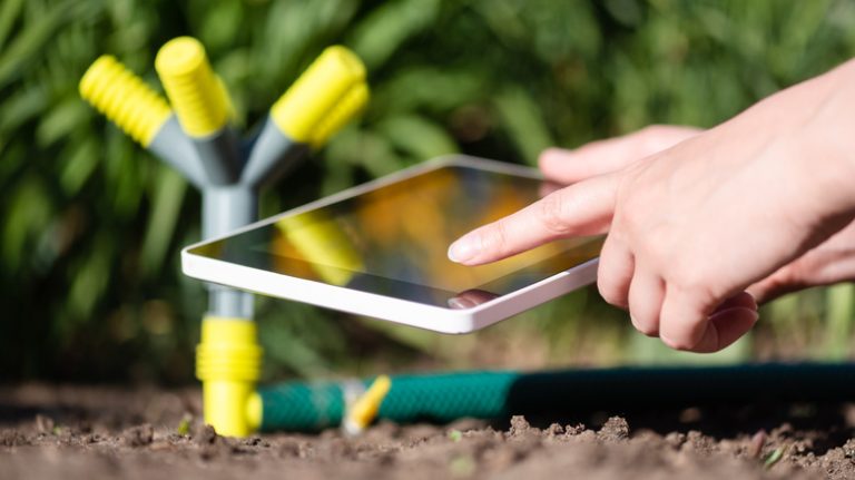 Hand controlling sprinkler from tablet