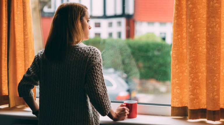 Woman looking out the window