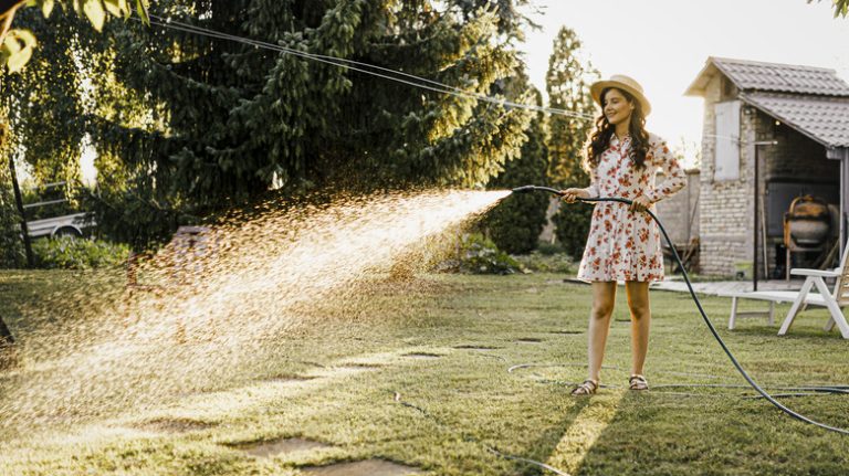 woman watering lawn