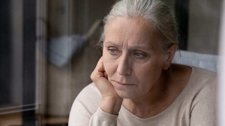 older woman looking unhappy