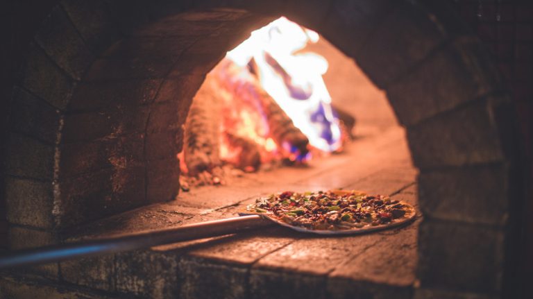 pizza in a brick pizza oven