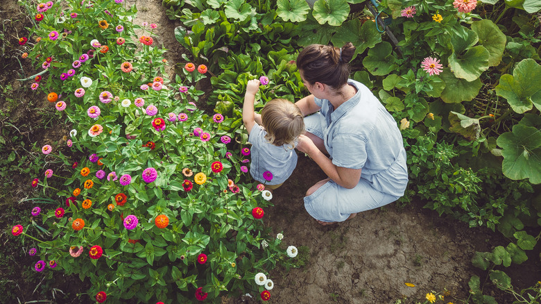 Mother and child in a thriving garden
