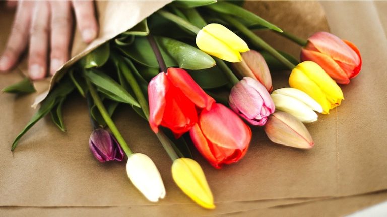 Person packing flowers